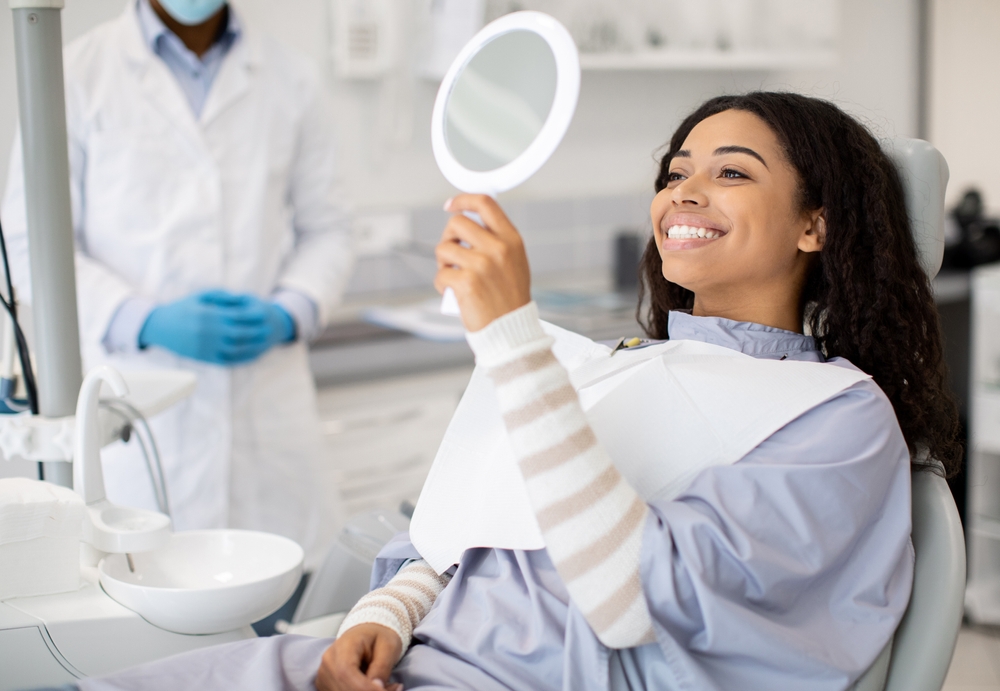 Dentist discussing tooth sensitivity solutions with a patient